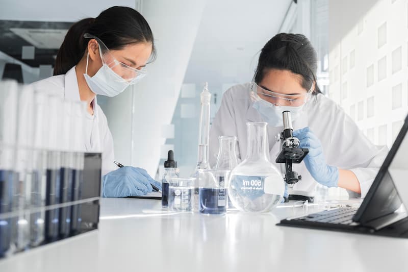 Chemical researchers collaborating on a project in a laboratory
